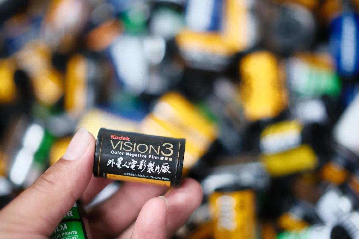 Person holding a box of Kodak film